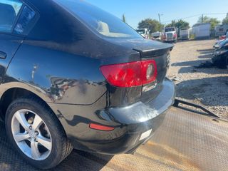 2006 Mazda Mazda3 i Touring - Exterior Rear Left Corner Image